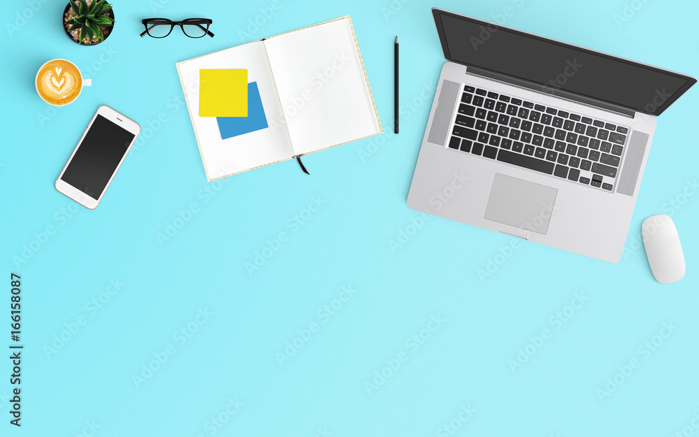 Modern workspace with coffee cup, notebook, smartphone and laptop copy space on Blue color background. Top view. Flat lay style. Modern workspace with coffee cup, notebook, smartphone and laptop copy space on Blue color background. Top view. Flat lay style.