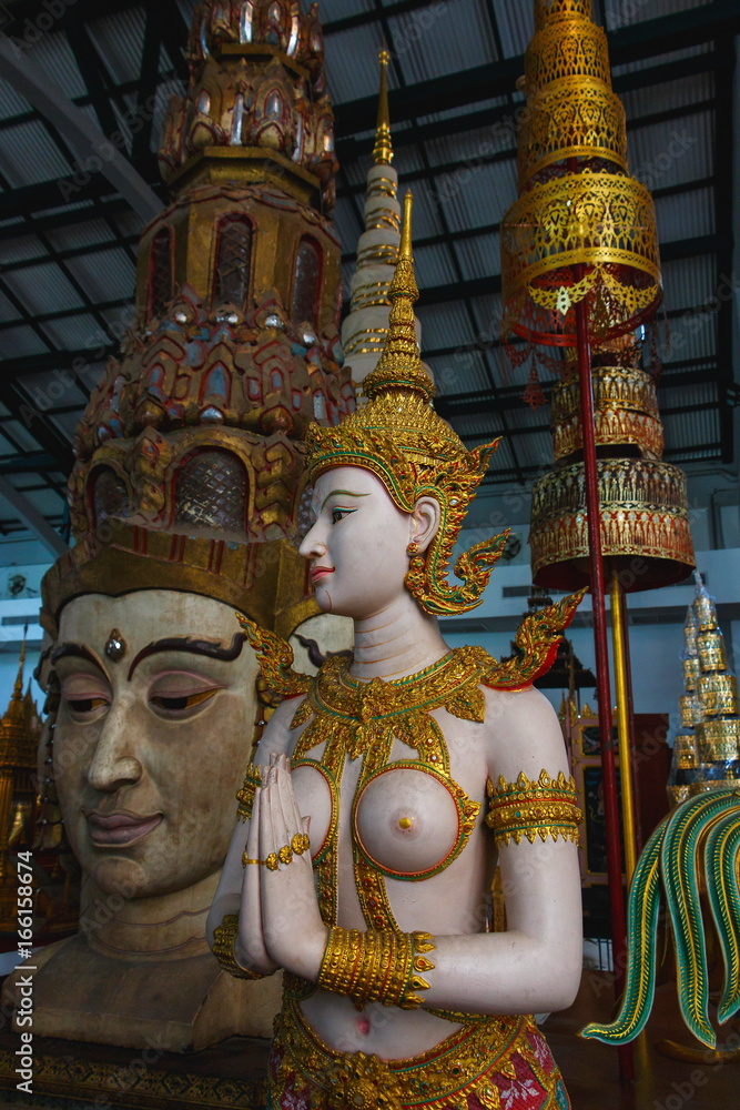 ancient art Golden Kinnaree,Golden Kinnaree in Wat Pra Kaeo,Thailand.