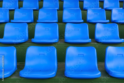 lines of blue stadium seats horizontal composition