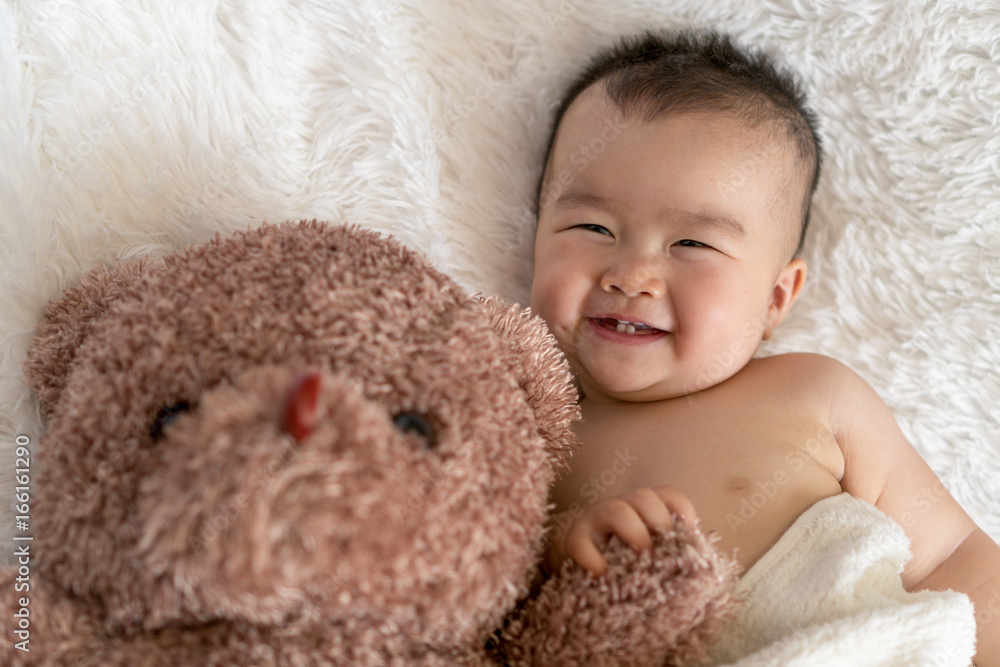 baby with bear toy baby with bear toy