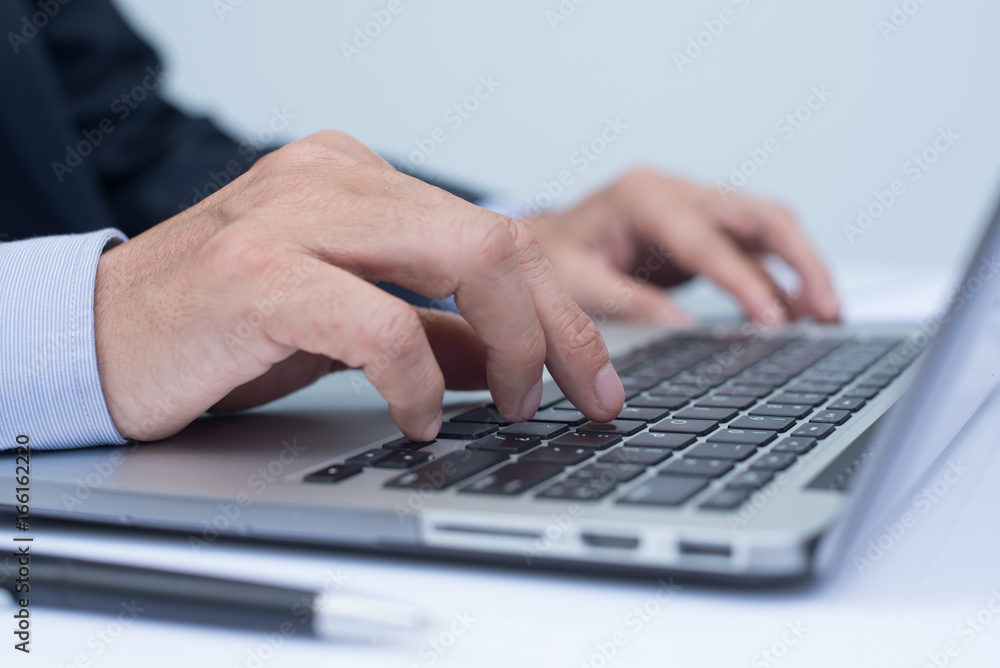 Businessman working on laptop computer Businessman working on laptop computer