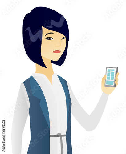 Disappointed asian business woman with cellphone.