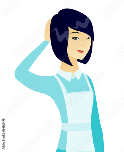 Young asian cleaner scratching her head.