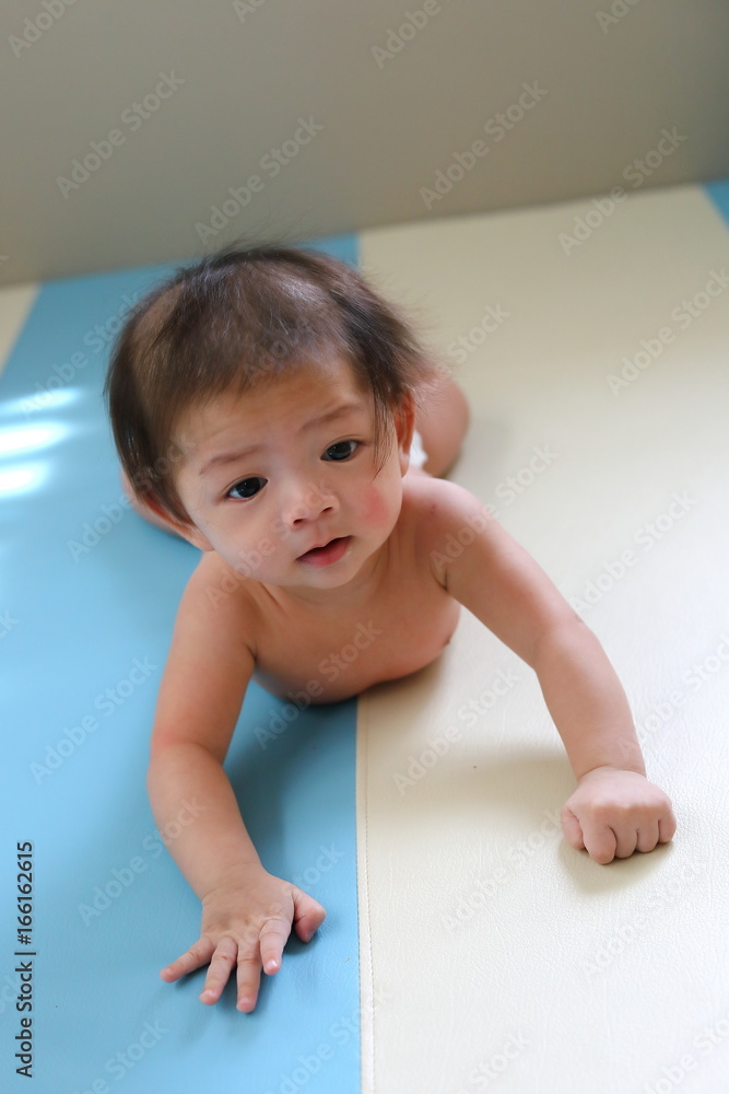adorable baby boy trying crawl clamber first time, cute asian child newborn 3 months adorable baby boy trying crawl clamber first time, cute asian child newborn 3 months