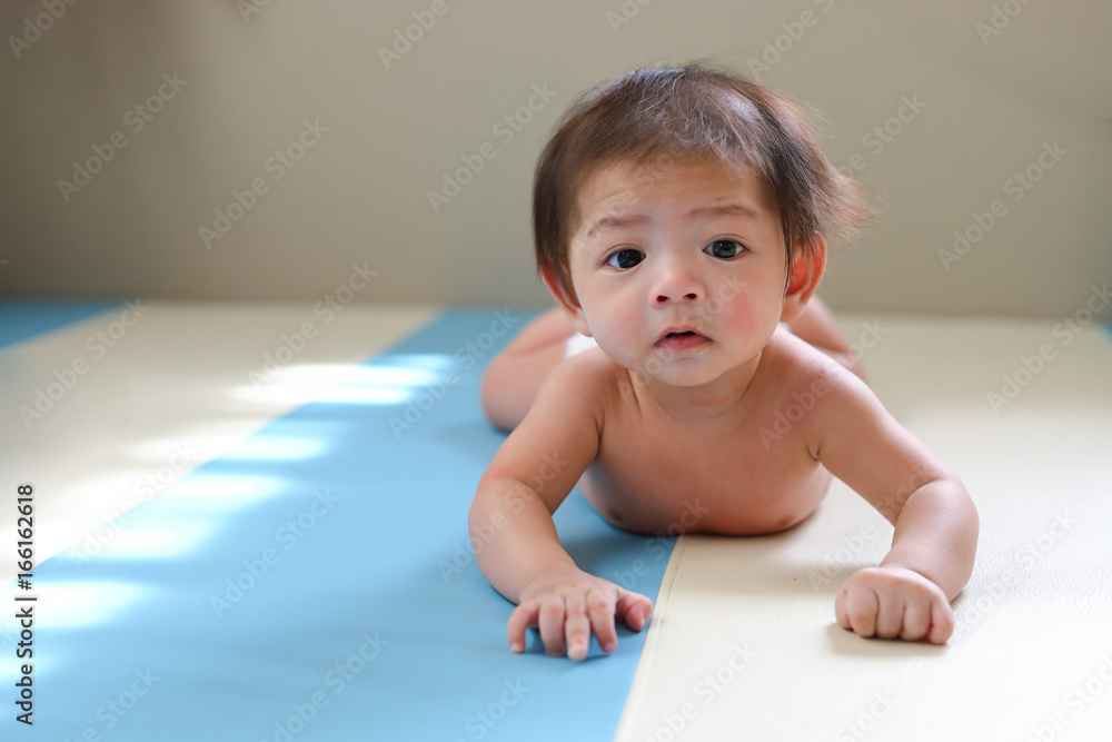 adorable baby boy trying crawl clamber first time, cute asian child newborn 3 months adorable baby boy trying crawl clamber first time, cute asian child newborn 3 months