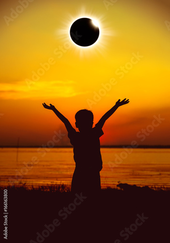 Scientific natural phenomenon. Total solar eclipse with diamond ring glowing on sky.