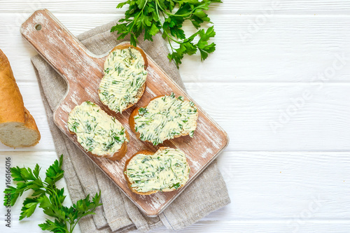 Sandwiches with herbs butter On Cutting board photo