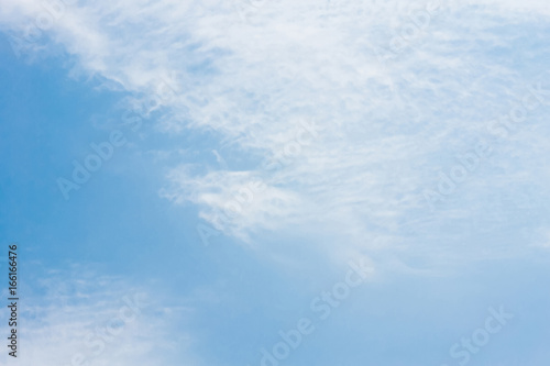 Blue sky with clouds background lines intersect.