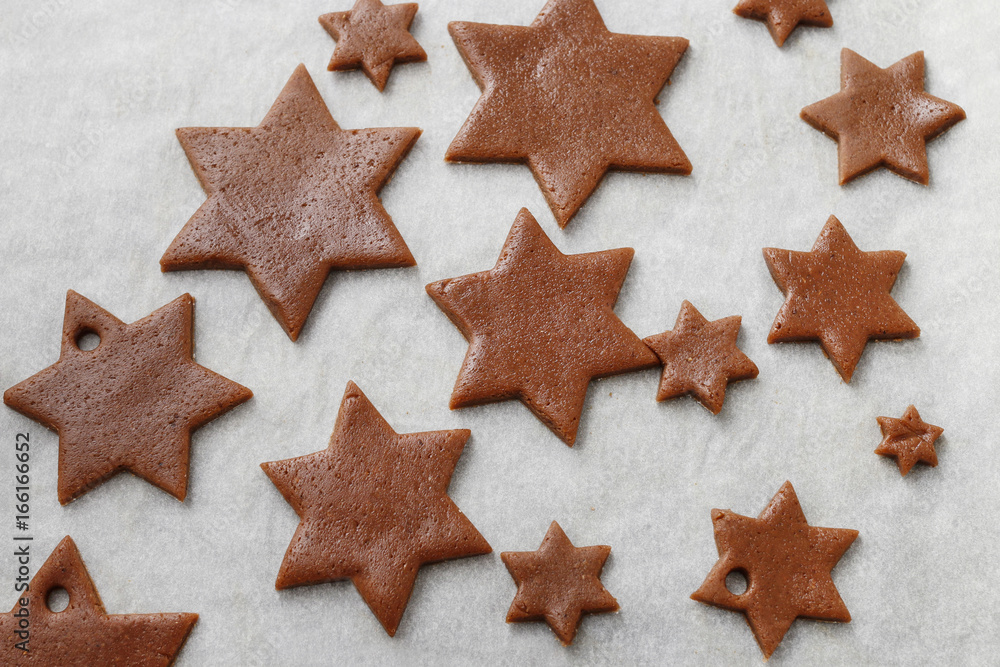 Gingerbread pastry, raw cookies prepared for baking. Gingerbread pastry, raw cookies prepared for baking.