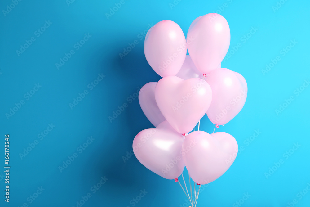 Pink heart balloons on blue background Pink heart balloons on blue background