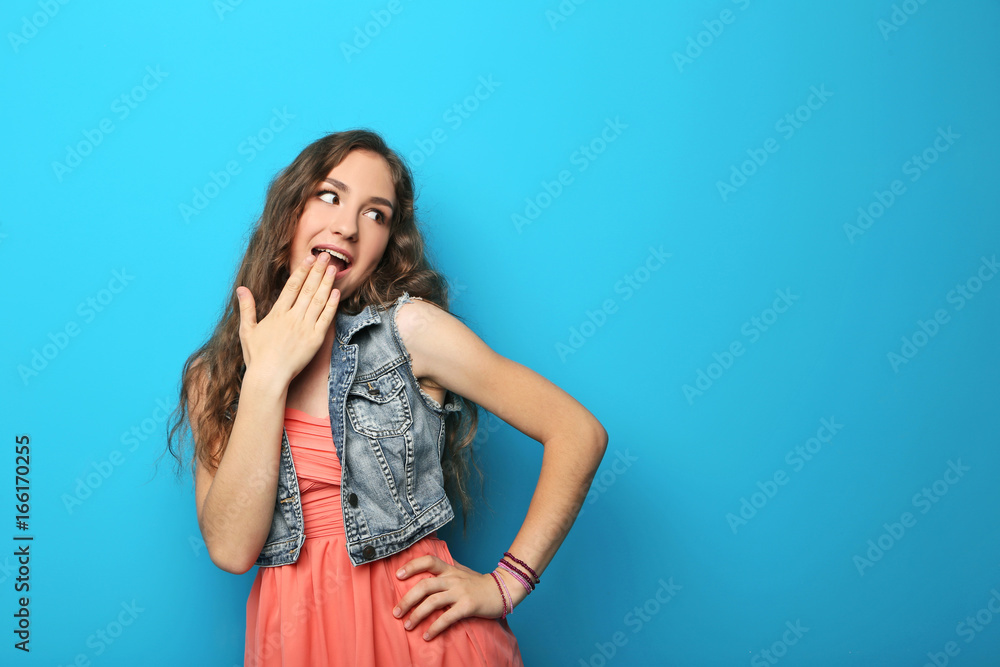 Portrait of young woman on blue background Portrait of young woman on blue background