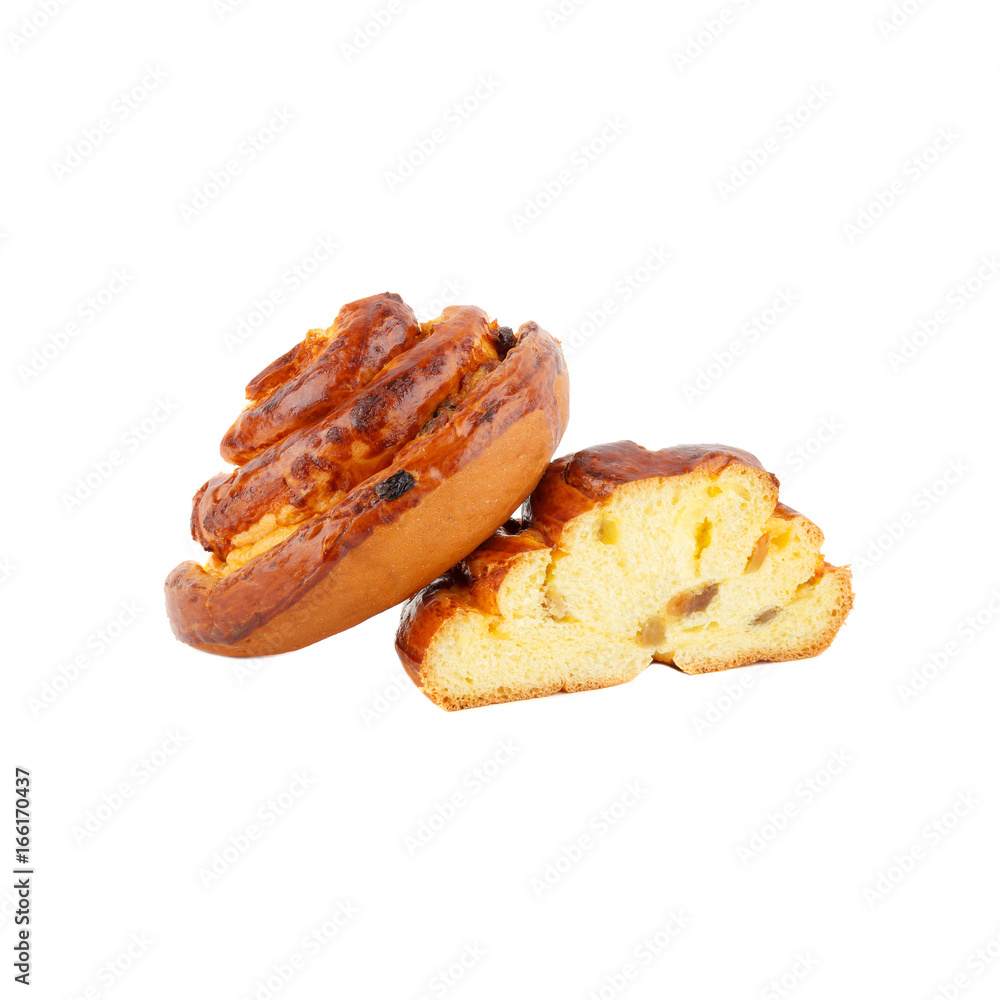 Home-made baking: Bun with raisins, isolated Home-made baking: Bun with raisins, isolated