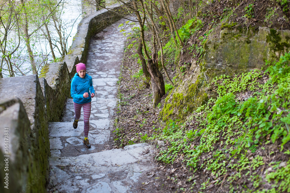 The woman running the stairs in the Park. The woman running the stairs in the Park.