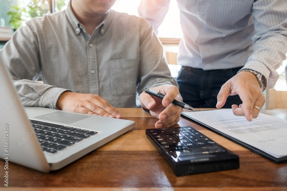 Administrator business man financial inspector and secretary making report, calculating or checking balance. Internal Revenue Service inspector checking document. Audit concept Administrator business man financial inspector and secretary making report, calculating or checking balance. Internal Revenue Service inspector checking document. Audit concept