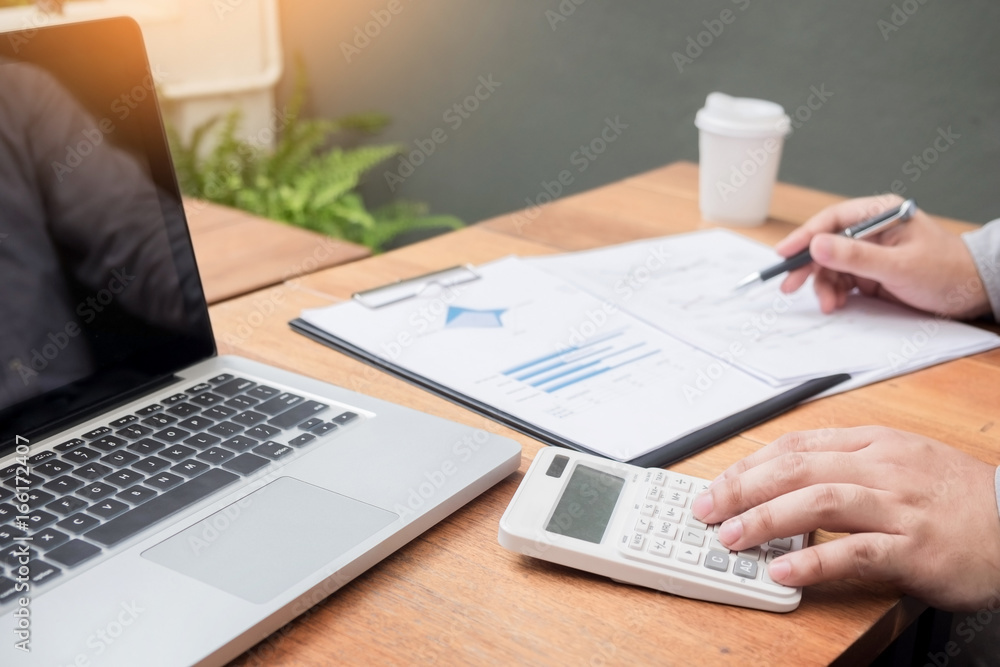 Administrator business man financial inspector and secretary making report, calculating or checking balance. Internal Revenue Service inspector checking document. Audit concept Administrator business man financial inspector and secretary making report, calculating or checking balance. Internal Revenue Service inspector checking document. Audit concept