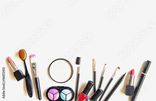 Cosmetics and fashion background with make up artist objects: lipstick, eye shadows, mascara ,eyeliner, concealer, nail polish.  Lifestyle Concept