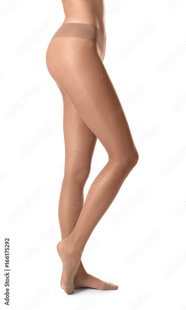 Legs of beautiful young woman in tights on white background Legs of beautiful young woman in tights on white background