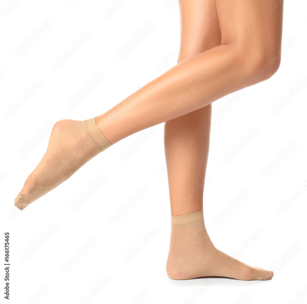 Legs of beautiful young woman in socks on white background Legs of beautiful young woman in socks on white background