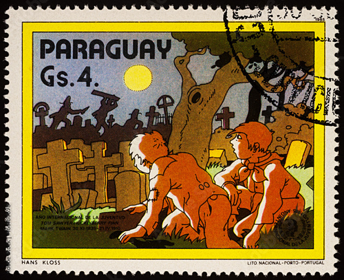 Tom Sawyer and Huck Finn at the cemetery on postage stamp photo