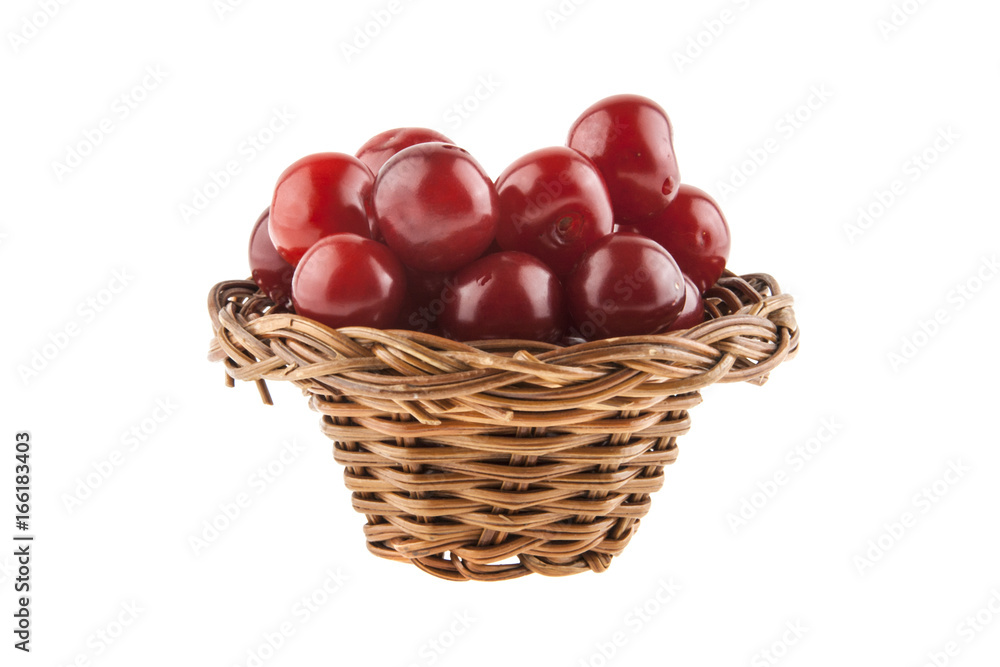 Cherries in a wicker basket isolated on a white background Cherries in a wicker basket isolated on a white background