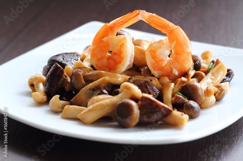 Shrimp and mixed mushroom stire fried. photo