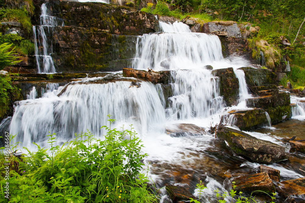 Obraz premium waterfall Tvindefossen in summer, Norway