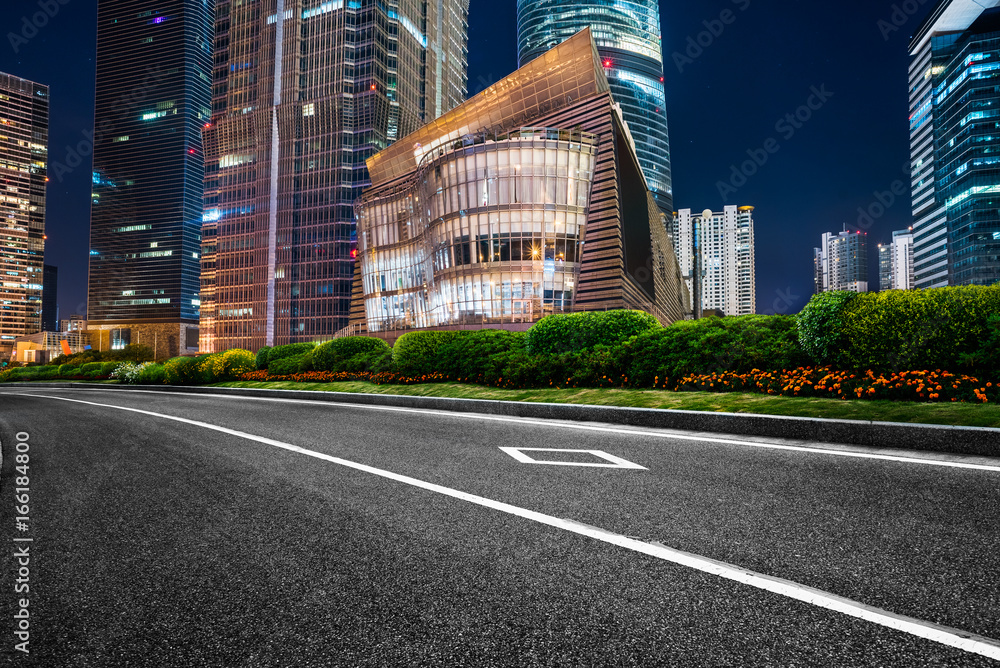 traffic road through modern city at night in Shanghai, China.