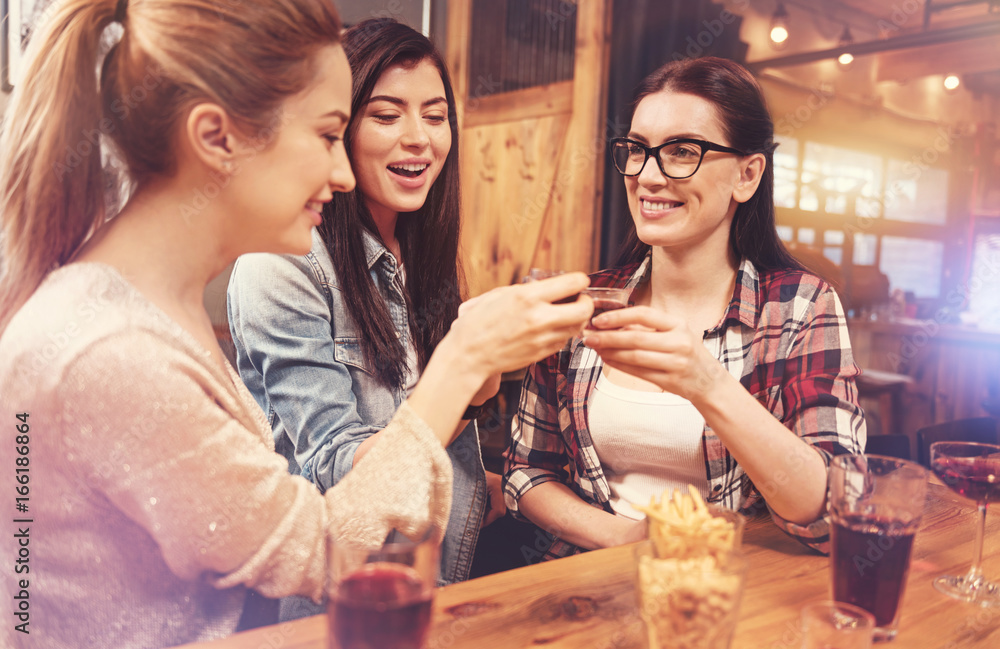 Beautiful females posing with glasses of alcohol Beautiful females posing with glasses of alcohol