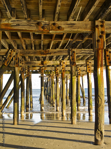 Sunset under the boardwalk at the northern end of Atlantic City, New Jersey, USA