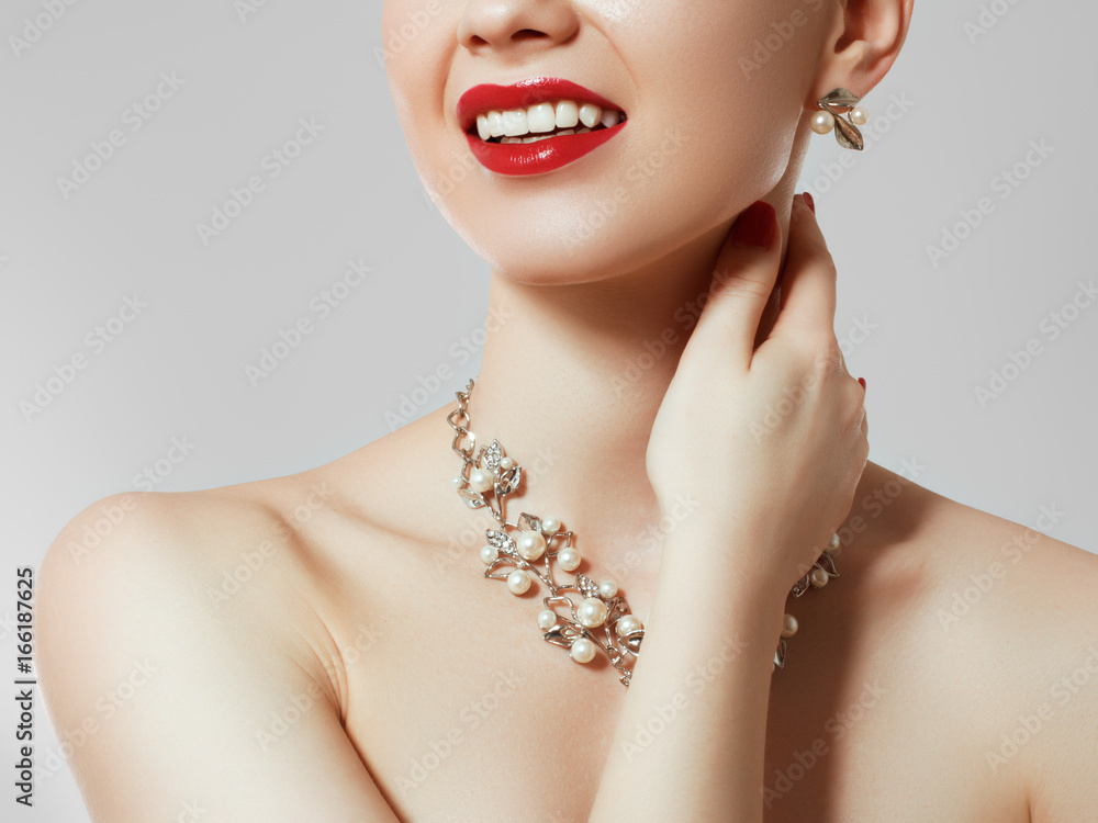 Beautiful woman with diamond necklace. Young beauty model with diamond pendant and earrings. Jewellery and accessories. Fashion and beauty salon. Perfect lip makeup