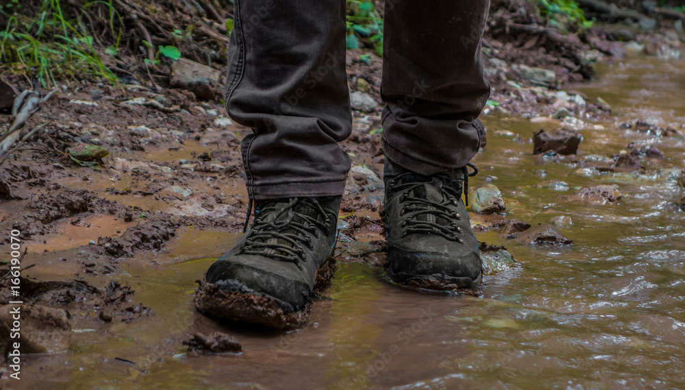Shoes in the mud in the Creek in the woods Shoes in the mud in the Creek in the woods