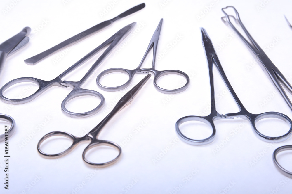 Close Up Surgical instruments and tools on white background. Selective focus.