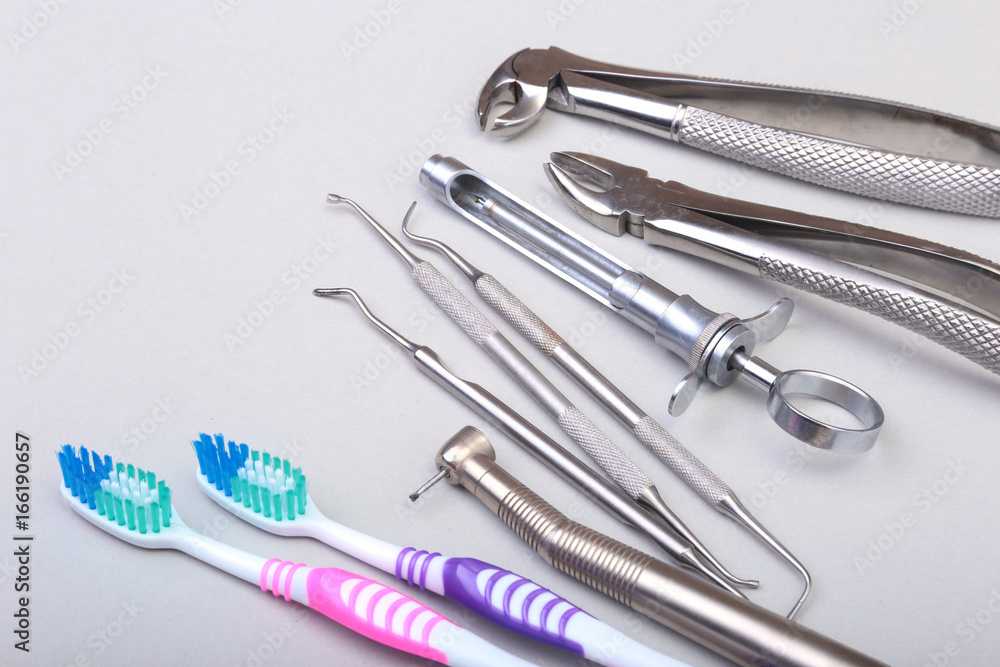 dental care toothbrush with dentist tools isolated on white background. Selective focus. dental care toothbrush with dentist tools isolated on white background. Selective focus.
