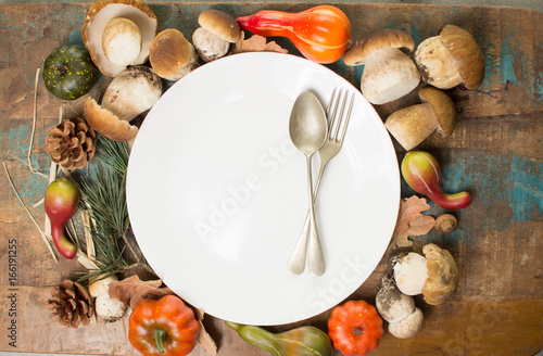 Autumn dinner concept - cutting board with fresh porcini boletus oak muchrooms, high quality, ready to cook photo