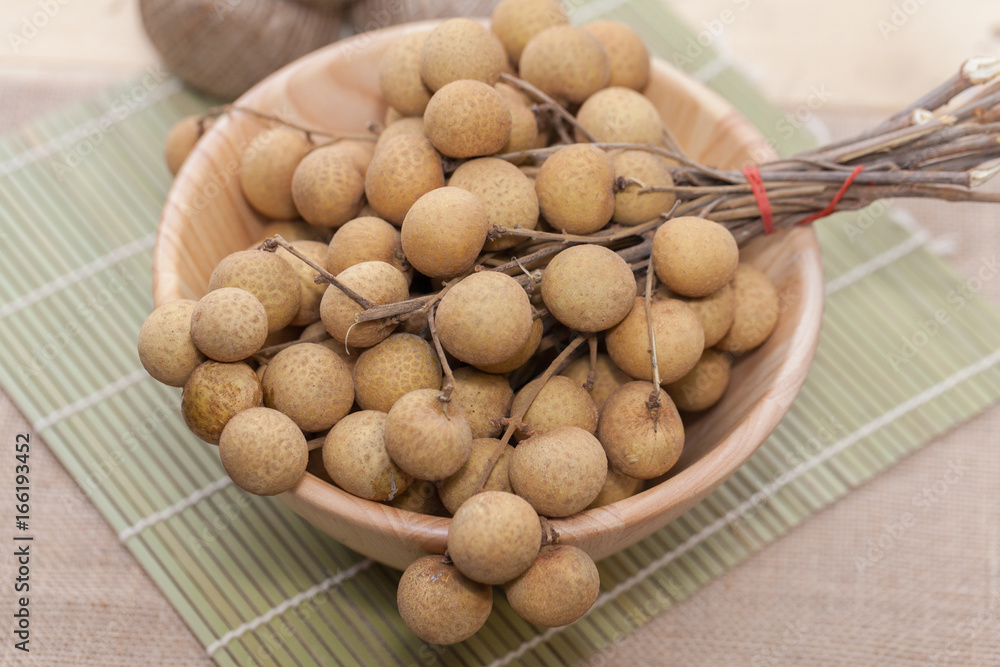 Longan on wood bowl Longan on wood bowl