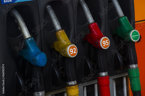 Gas station. Colored pistols for refueling gasoline