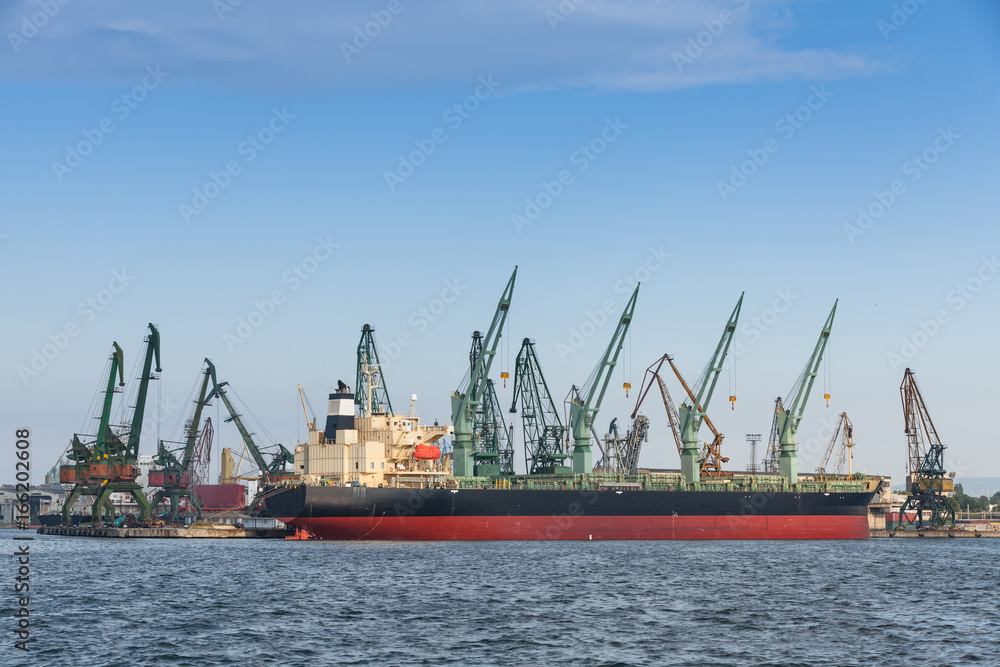 Bulk carrier, big cargo ship stands moored in port