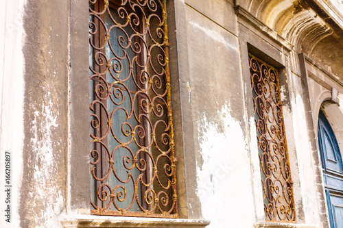 Window with lattice in old building photo