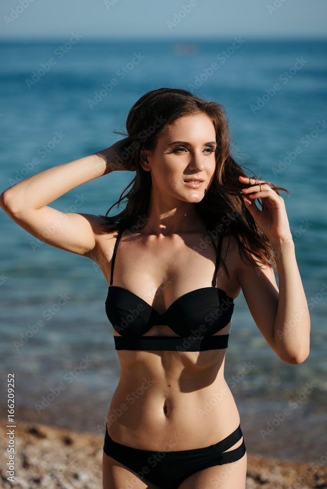 Young woman at sea. Sunset time outdoor portrait. Crimea, Balaklava Young woman at sea. Sunset time outdoor portrait. Crimea, Balaklava