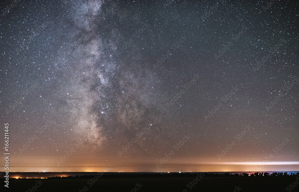 The center of our home galaxy, the Milky Way rising over the field, the night stars landscape