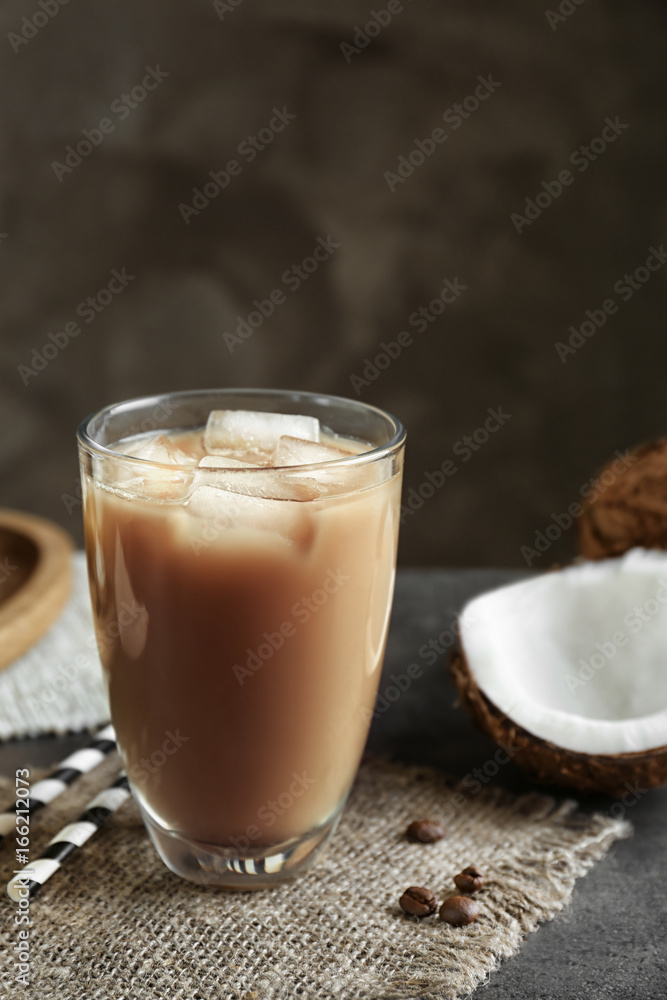 Glass of cold tasty coconut coffee on table Glass of cold tasty coconut coffee on table
