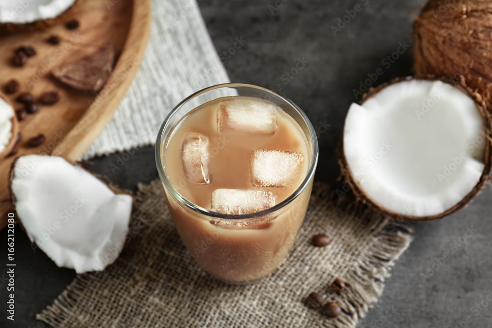 Glass of cold tasty coconut coffee on table Glass of cold tasty coconut coffee on table