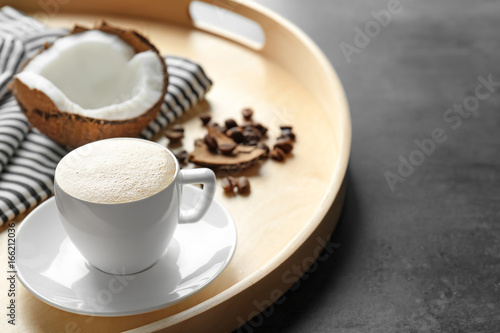 Wallpaper Mural Tray with cup of tasty coconut coffee and nut on table Torontodigital.ca