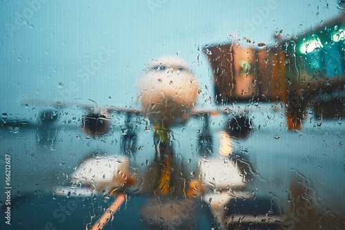 Obraz na płótnie A busy airport in the rain