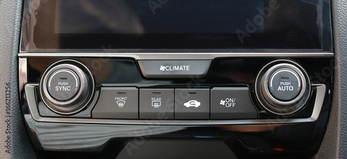 Close up shot of luxury car audio controls.