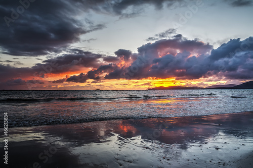 Dark clouds over the sea at sunset