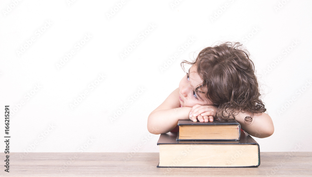 curly haired girl is dreaming over her books curly haired girl is dreaming over her books