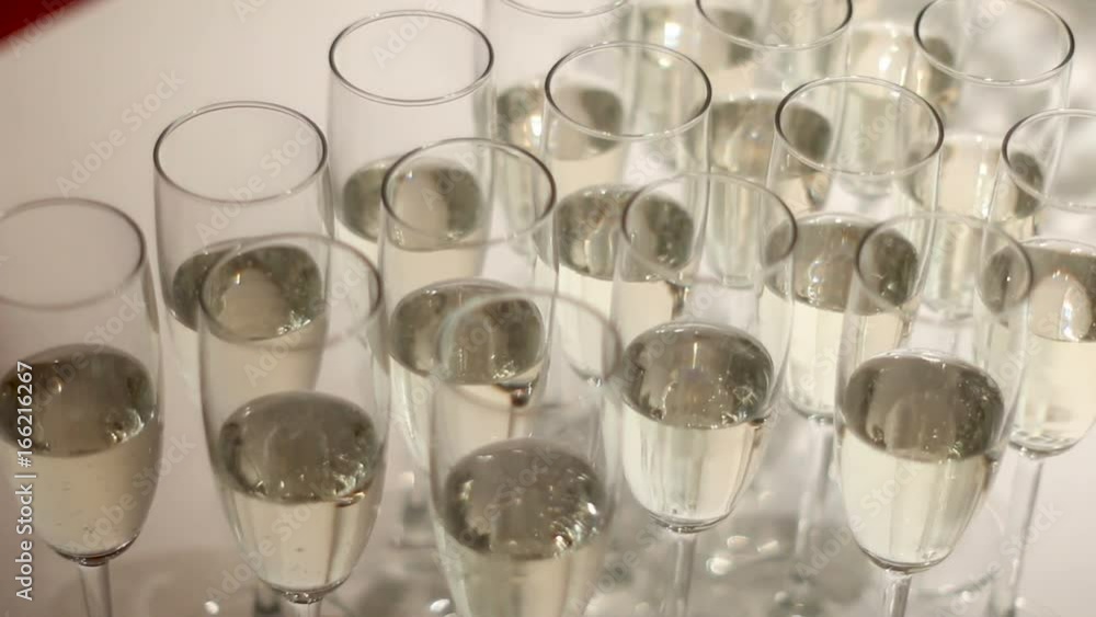 champagne glasses with bubbles standing on the table