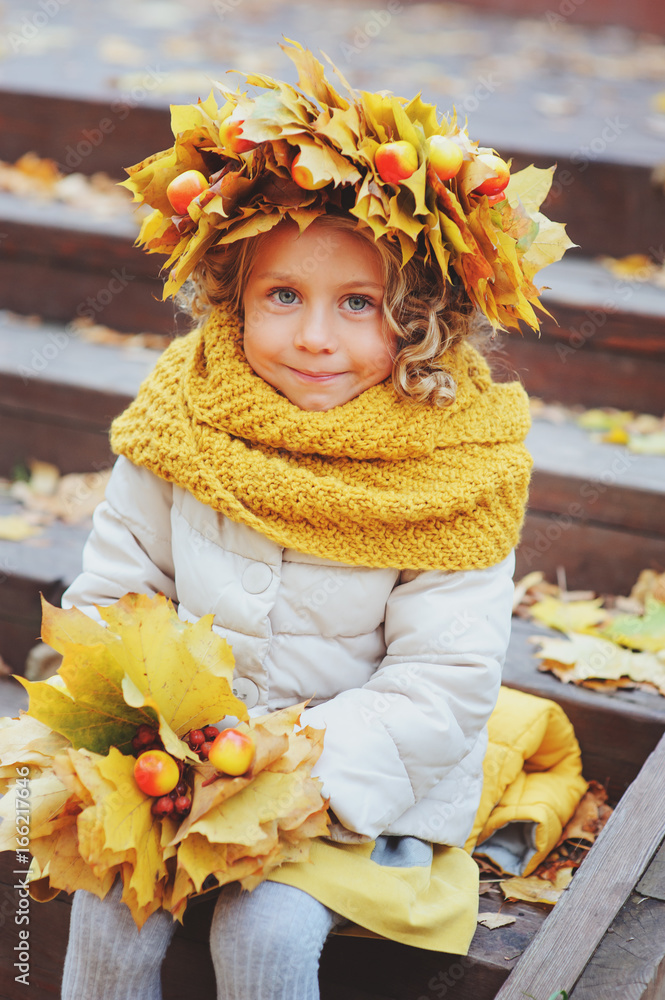 cute adorable toddler girl portrait with bouquet of autumn leaves and wreath walking outdoor in park or forest cute adorable toddler girl portrait with bouquet of autumn leaves and wreath walking outdoor in park or forest