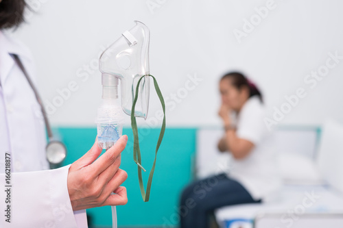 Doctor holding oxygen mask with nebulizer, Prepare inhaler for asthma patient.